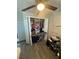 Bedroom closet with ceiling fan and laminate floors at 2344 Tahitian Dr, Holiday, FL 34691