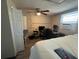 This bedroom is spacious and equipped with a ceiling fan and laminate floors at 2344 Tahitian Dr, Holiday, FL 34691