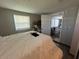 The bedroom boasts a window, laminate floors and neutral paint at 2344 Tahitian Dr, Holiday, FL 34691
