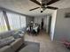 Cozy dining room area with large windows and tiled floors at 2344 Tahitian Dr, Holiday, FL 34691