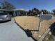 Charming home featuring rock landscaping, a gray driveway, and a white mailbox at 2344 Tahitian Dr, Holiday, FL 34691