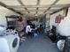 Garage filled with stored belongings and appliances at 2344 Tahitian Dr, Holiday, FL 34691