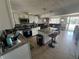 Modern kitchen featuring granite countertops, stainless appliances, and a breakfast bar at 2344 Tahitian Dr, Holiday, FL 34691