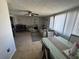 Open-concept living room with natural light and a connecting dining area at 2344 Tahitian Dr, Holiday, FL 34691