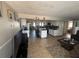 Bright, open-concept living area flowing into kitchen, tile floors and neutral walls at 2344 Tahitian Dr, Holiday, FL 34691