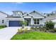 Charming single-Gathering home with a well-manicured lawn and a two-car garage, offering curb appeal at 2497 Orange Harvest Pl, Seffner, FL 33584