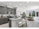 Stylish kitchen featuring granite countertops, stainless steel appliances, and an adjacent dining area with natural light at 2497 Orange Harvest Pl, Seffner, FL 33584