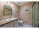 Full bathroom featuring a granite-topped vanity, toilet, and glass-door shower at 2720 Lancaster Dr, Sun City Center, FL 33573