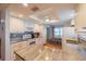 Stylish kitchen showcasing granite counters, white cabinets, modern appliances, and a cozy dining area at 2720 Lancaster Dr, Sun City Center, FL 33573