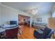 Cozy living room features hardwood floors, crown molding, and neutral paint colors at 2720 Lancaster Dr, Sun City Center, FL 33573
