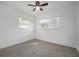 Bedroom with white walls, carpet, and lots of natural light from two windows at 2918 W Ellis Dr, Tampa, FL 33611