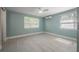 Bright bedroom with tile floors, large windows, and neutral color palette at 2918 W Ellis Dr, Tampa, FL 33611