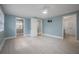 Bedroom featuring tile floors, ceiling fan, and ensuite bathroom and walk-in closet at 2918 W Ellis Dr, Tampa, FL 33611