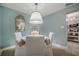 Cozy dining room features elegant decor, soft lighting and seating for four at 2918 W Ellis Dr, Tampa, FL 33611