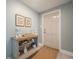 Inviting entryway with a stylish console table, decorative items, and tile flooring at 2918 W Ellis Dr, Tampa, FL 33611