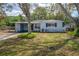 Charming one-story home with a well-maintained front yard and covered parking at 2918 W Ellis Dr, Tampa, FL 33611