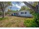 Charming single-story home with a well-maintained front yard and a covered entry at 2918 W Ellis Dr, Tampa, FL 33611
