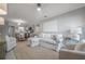 Comfortable living room adjacent to kitchen with plush seating and natural light at 2918 W Ellis Dr, Tampa, FL 33611
