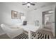 Bright office with stylish desk and chair, ceiling fan, and black and white rug at 2918 W Ellis Dr, Tampa, FL 33611