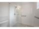 Glass enclosed shower with white subway tile and grey stone floor at 2918 W Ellis Dr, Tampa, FL 33611
