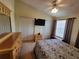 Comfortable bedroom with large bed, ceiling fan, and closet space at 310 Kensington Lake Cir, Brandon, FL 33511