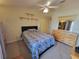 Bedroom with furniture set, ceiling fan, and large dresser with mirror at 310 Kensington Lake Cir, Brandon, FL 33511