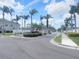 Community entry gate featuring landscaping and an automatic gate for privacy at 310 Kensington Lake Cir, Brandon, FL 33511
