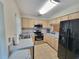 Kitchen with stainless steel appliances, ample cabinet space, and tile flooring at 310 Kensington Lake Cir, Brandon, FL 33511