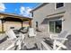 Backyard area features an outdoor pergola and lounge seating at 31386 Penny Surf Loop, Wesley Chapel, FL 33545