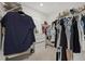 Walk-in closet with organized clothing racks and shelving, offering ample storage space at 31386 Penny Surf Loop, Wesley Chapel, FL 33545