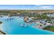 An amazing aerial view showcases the neighborhood lagoon with many resort-style amenities and a large community at 31386 Penny Surf Loop, Wesley Chapel, FL 33545