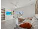 Cozy living room with built-in shelving, tile floors and sliding doors to the backyard at 31386 Penny Surf Loop, Wesley Chapel, FL 33545