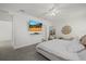 Bright bedroom with a TV, mirror, and comfortable bed, creating a relaxing retreat at 31386 Penny Surf Loop, Wesley Chapel, FL 33545