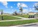 A delightful community playground with play structures, benches, and a grassy field offers a fun and safe place at 31386 Penny Surf Loop, Wesley Chapel, FL 33545