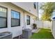Backyard area with privacy fence, artificial turf, and outdoor grill at 3215 W De Leon St # 6, Tampa, FL 33609
