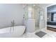 This modern bathroom boasts marble floors, a standalone soaking tub, and a glass-enclosed shower at 3215 W De Leon St # 6, Tampa, FL 33609