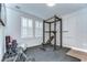 Home exercise room featuring fitness equipment and windows with shutters at 3215 W De Leon St # 6, Tampa, FL 33609
