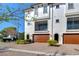 Well-maintained townhome featuring a brick driveway, and manicured landscaping at 3215 W De Leon St # 6, Tampa, FL 33609
