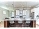 Elegant kitchen with a large island, stainless steel appliances, and stylish pendant lighting at 3215 W De Leon St # 6, Tampa, FL 33609