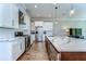 Spacious kitchen featuring white cabinets, stainless steel appliances, and a large island at 3215 W De Leon St # 6, Tampa, FL 33609