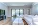 Living room area featuring a large balcony, hardwood floors, and modern design at 3215 W De Leon St # 6, Tampa, FL 33609