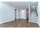 An open living space featuring hardwood floors and staircase at 3215 W De Leon St # 6, Tampa, FL 33609