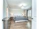 Serene main bedroom with hardwood floors, neutral walls, and modern lighting at 3215 W De Leon St # 6, Tampa, FL 33609