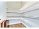 Walk-in pantry features wire shelving for optimal storage in a well-lit space with wood flooring at 3215 W De Leon St # 6, Tampa, FL 33609