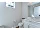 Charming powder room featuring a white vanity, granite countertop, and stylish fixtures at 3215 W De Leon St # 6, Tampa, FL 33609
