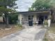 The exterior of a single Gathering home with a partially covered front porch and mature landscaping at 3225 11Th N Ave, St Petersburg, FL 33713