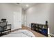 Bright bedroom with hardwood floors, white walls, and multiple doorways leading to other rooms at 3319 Gulf City Rd, Ruskin, FL 33570