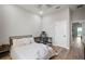 Comfortable bedroom featuring a bed, desk, and ample natural light at 3319 Gulf City Rd, Ruskin, FL 33570