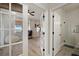 Bedroom doorway view, which features a desk, a comfy beanbag chair, and windows with water views at 3319 Gulf City Rd, Ruskin, FL 33570