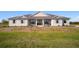 Charming single-story home featuring a covered front porch and well-maintained landscaping at 3319 Gulf City Rd, Ruskin, FL 33570